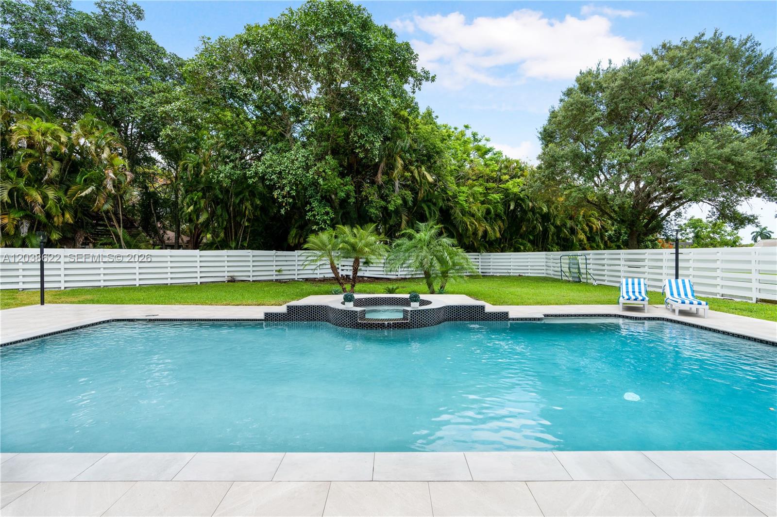 14830 Southwest 149th Street Miami, FL 33196 - Photo 23 of 43 a view of swimming pool with an outdoor space and seating area