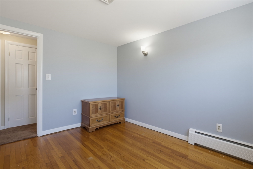 433 Pearse Road Swansea, MA 02777 - Photo 23 of 40 a view of room with hardwood floor