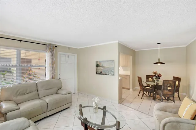 a view of a dining room that has a table and chairs