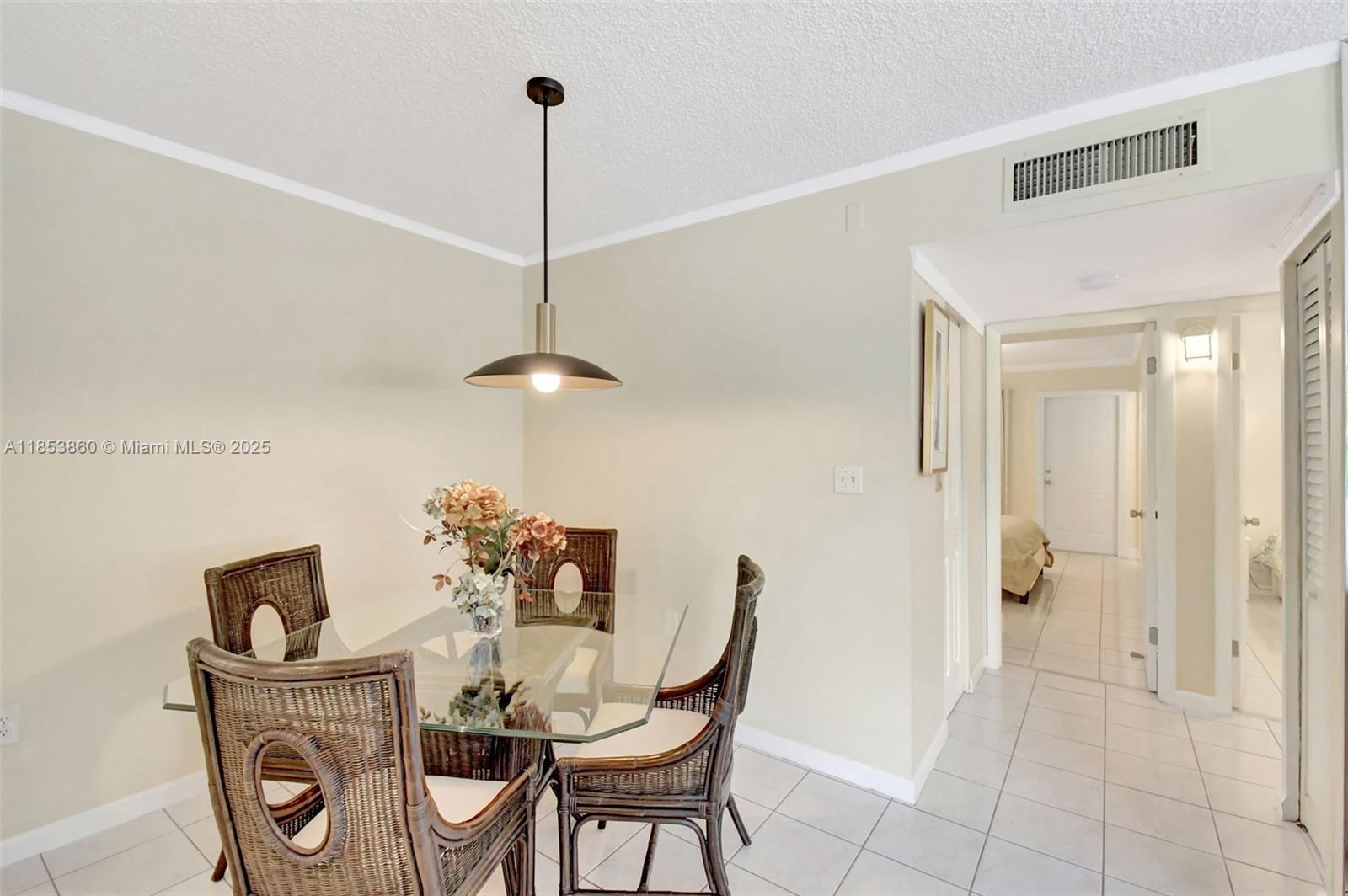 415 Northeast 2nd Street, Unit 124 Hallandale Beach, FL 33009 - Photo 15 of 36 a view of a dining room that has a table and chairs