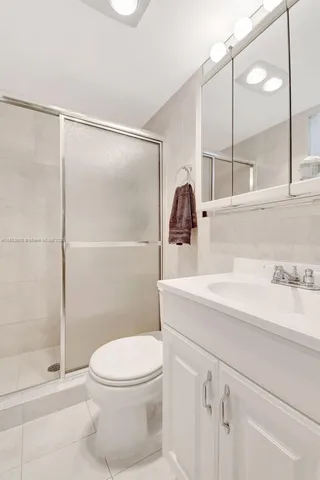 a bed room with a bed and a television