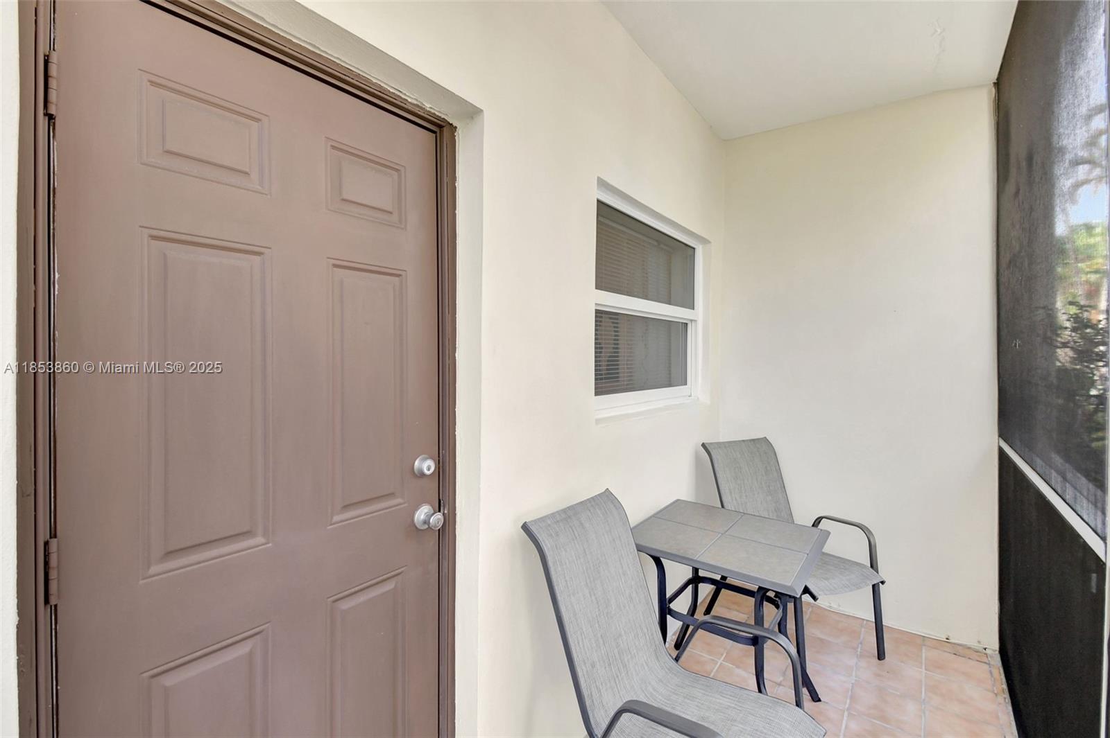415 Northeast 2nd Street, Unit 124 Hallandale Beach, FL 33009 - Photo 33 of 36 a view of a workspace room with furniture and wooden floor