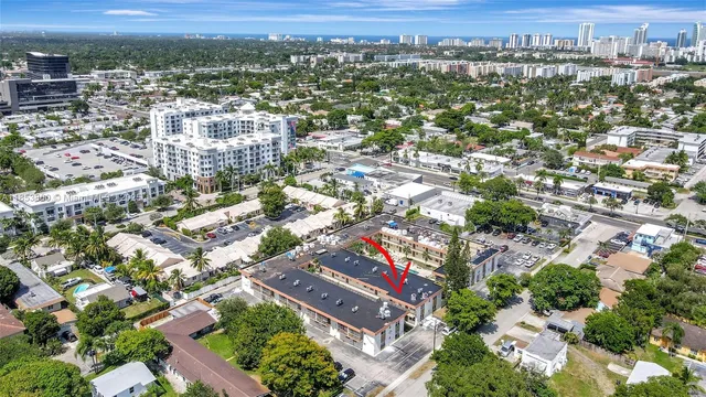 a view of a house with swimming pool and sitting area