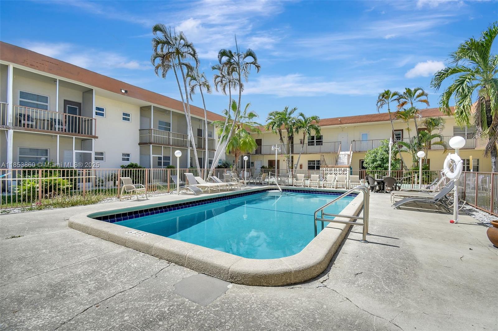 415 Northeast 2nd Street, Unit 124 Hallandale Beach, FL 33009 - Photo 6 of 36 a view of a house with swimming pool and sitting area