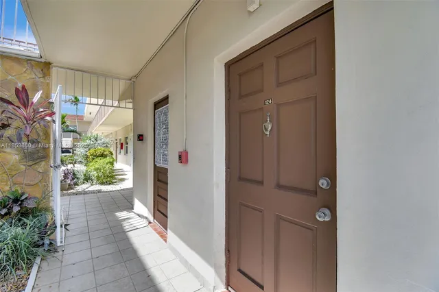 a view of a pathway along with potted plants