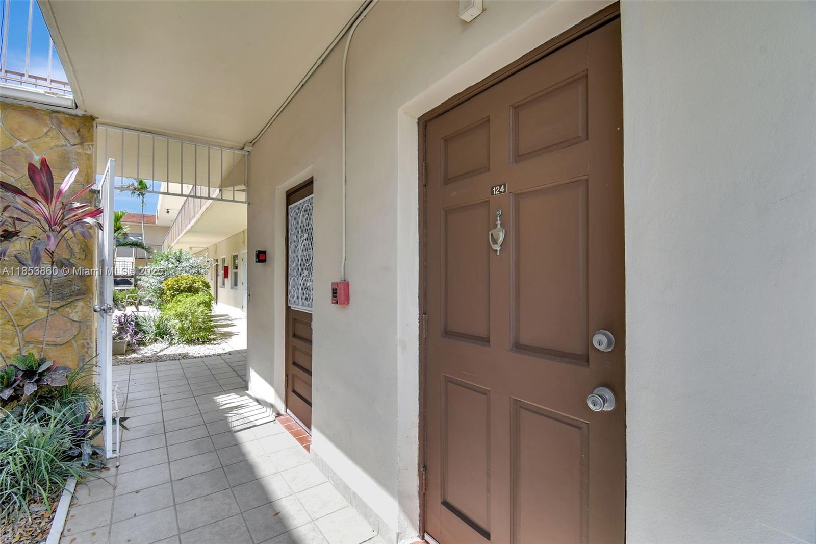 415 Northeast 2nd Street, Unit 124 Hallandale Beach, FL 33009 - Photo 8 of 36 a view of entryway door