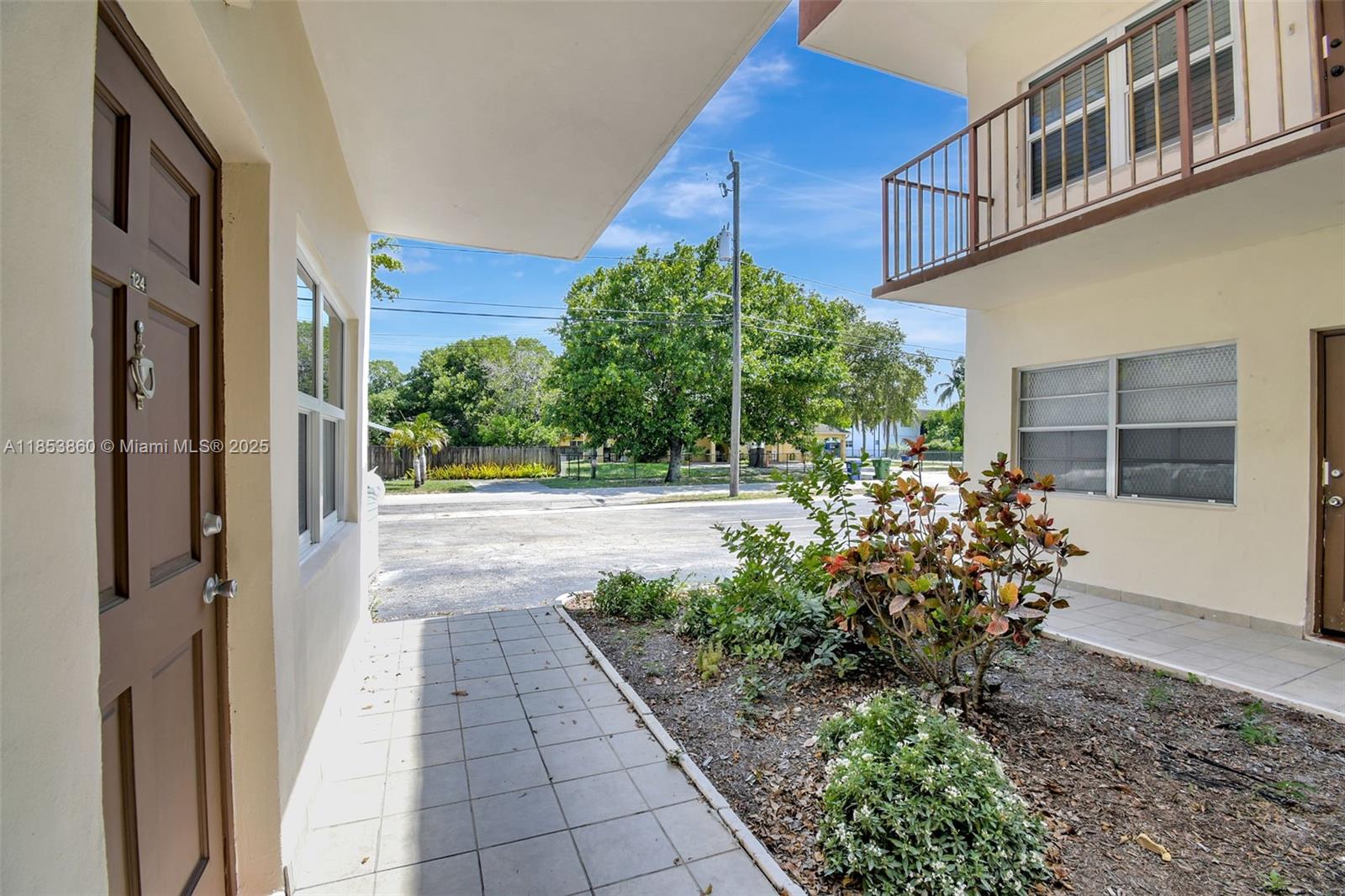 415 Northeast 2nd Street, Unit 124 Hallandale Beach, FL 33009 - Photo 9 of 36 a view of a pathway along with potted plants