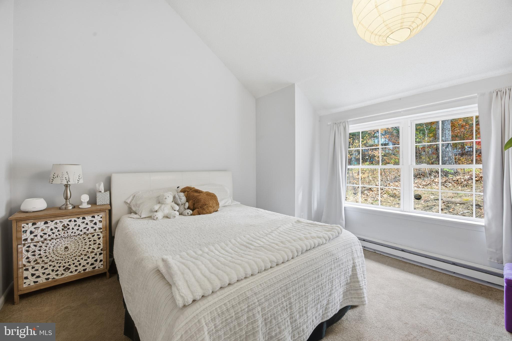 128 Hemlock Lane Gerrardstown, WV 25420 - Photo 11 of 44 a bedroom with a bed and a window