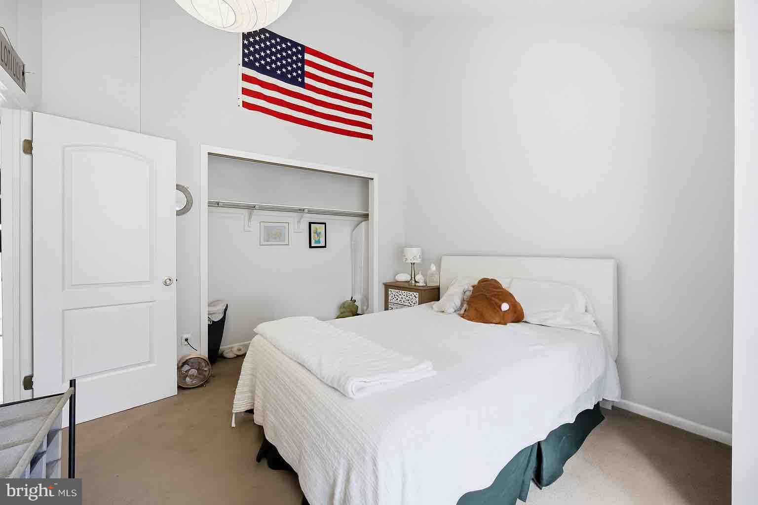 128 Hemlock Lane Gerrardstown, WV 25420 - Photo 12 of 44 a bedroom with a bed and wooden floor