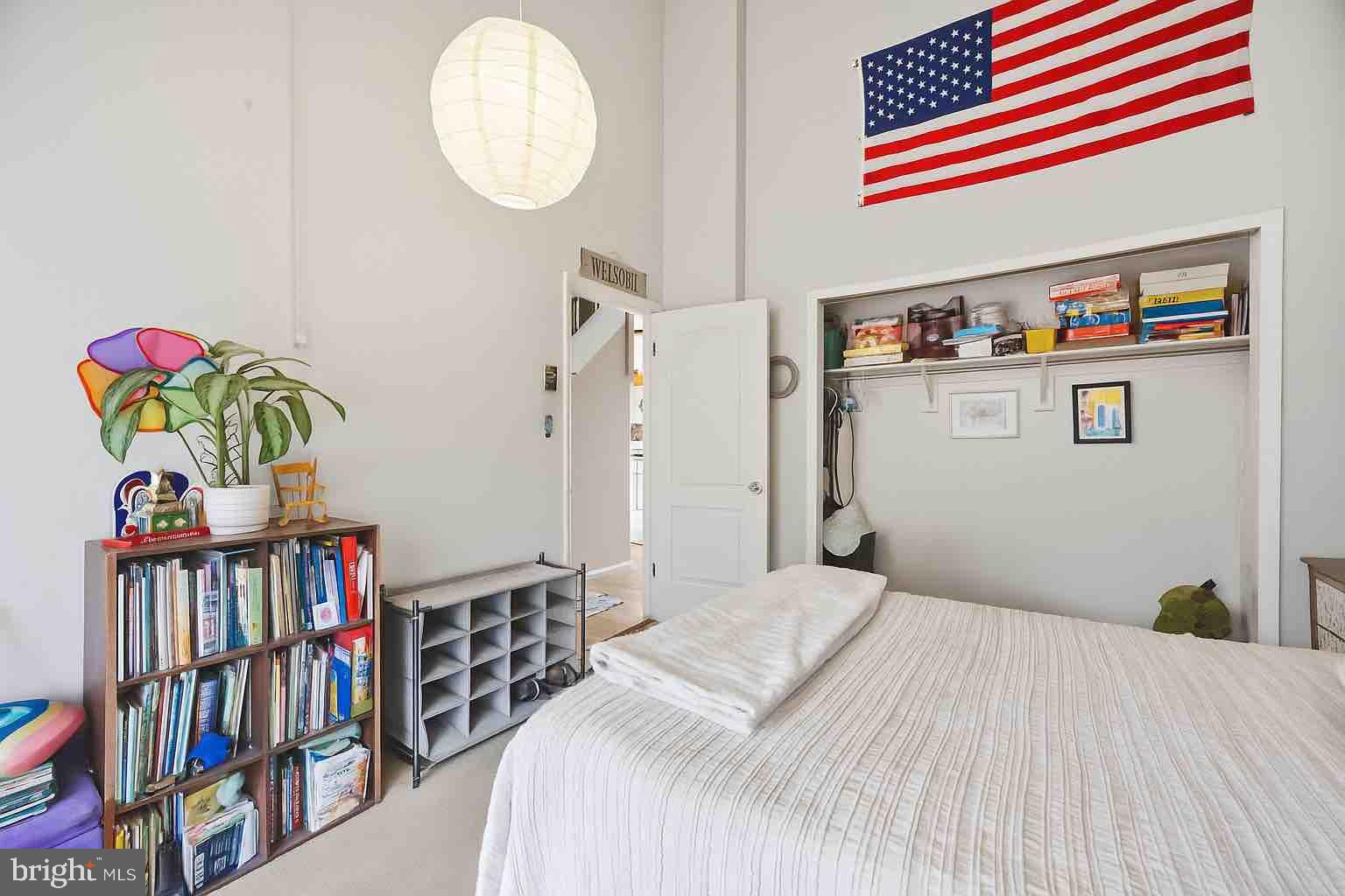 128 Hemlock Lane Gerrardstown, WV 25420 - Photo 13 of 44 a bedroom with a bed and a book shelf