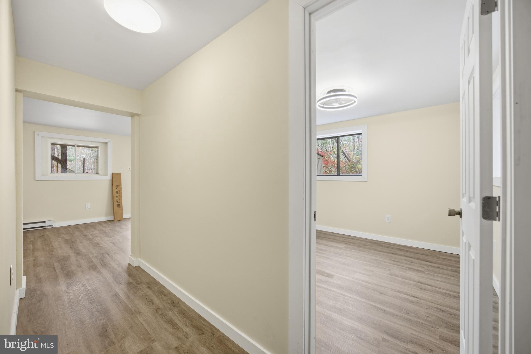 128 Hemlock Lane Gerrardstown, WV 25420 - Photo 24 of 44 a view of an empty room with wooden floor