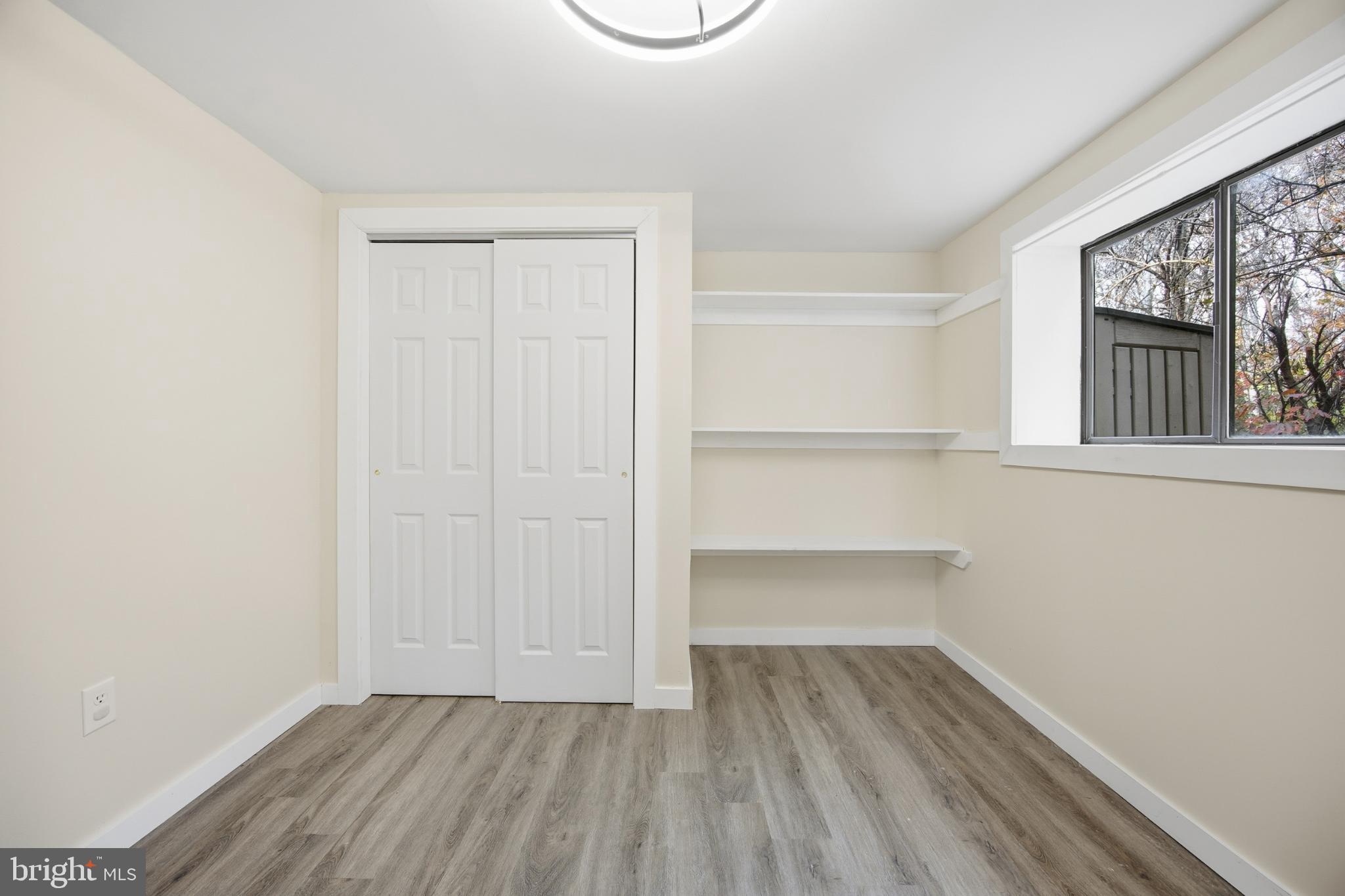 128 Hemlock Lane Gerrardstown, WV 25420 - Photo 26 of 44 a view of an empty room with closet and a window