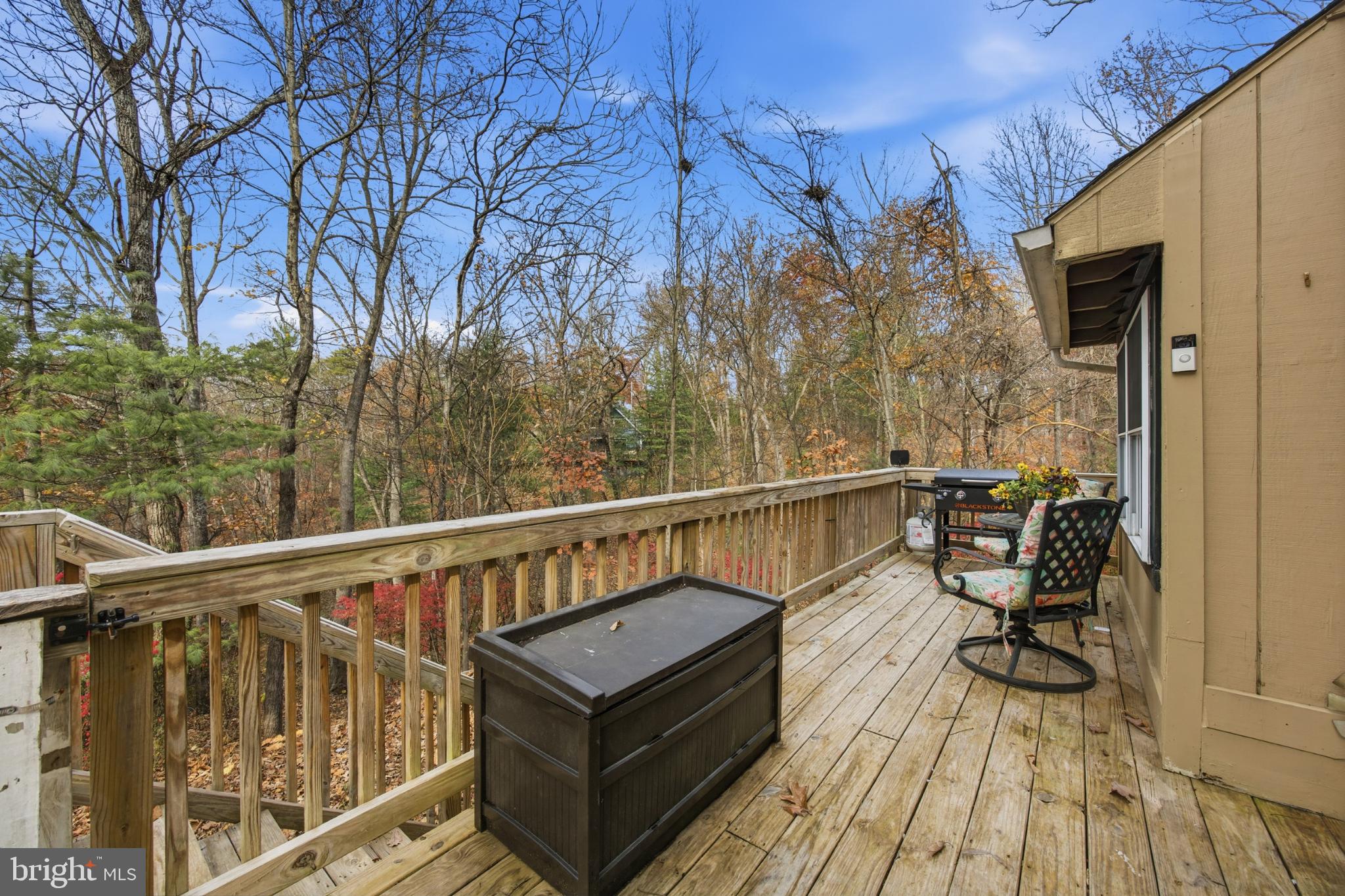 128 Hemlock Lane Gerrardstown, WV 25420 - Photo 41 of 44 a view of a balcony with chairs and wooden floor