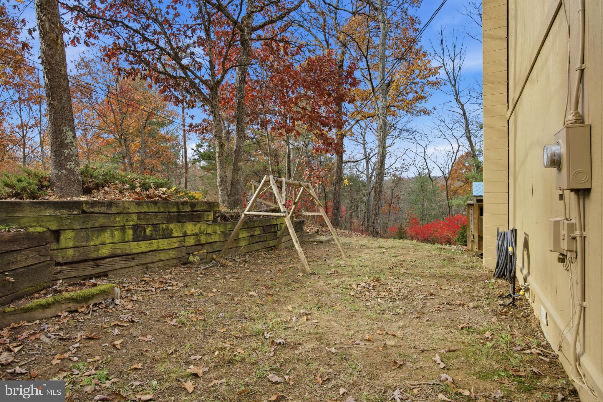 128 Hemlock Lane Gerrardstown, WV 25420 - Photo 43 of 44 a backyard of a house with lots of green space