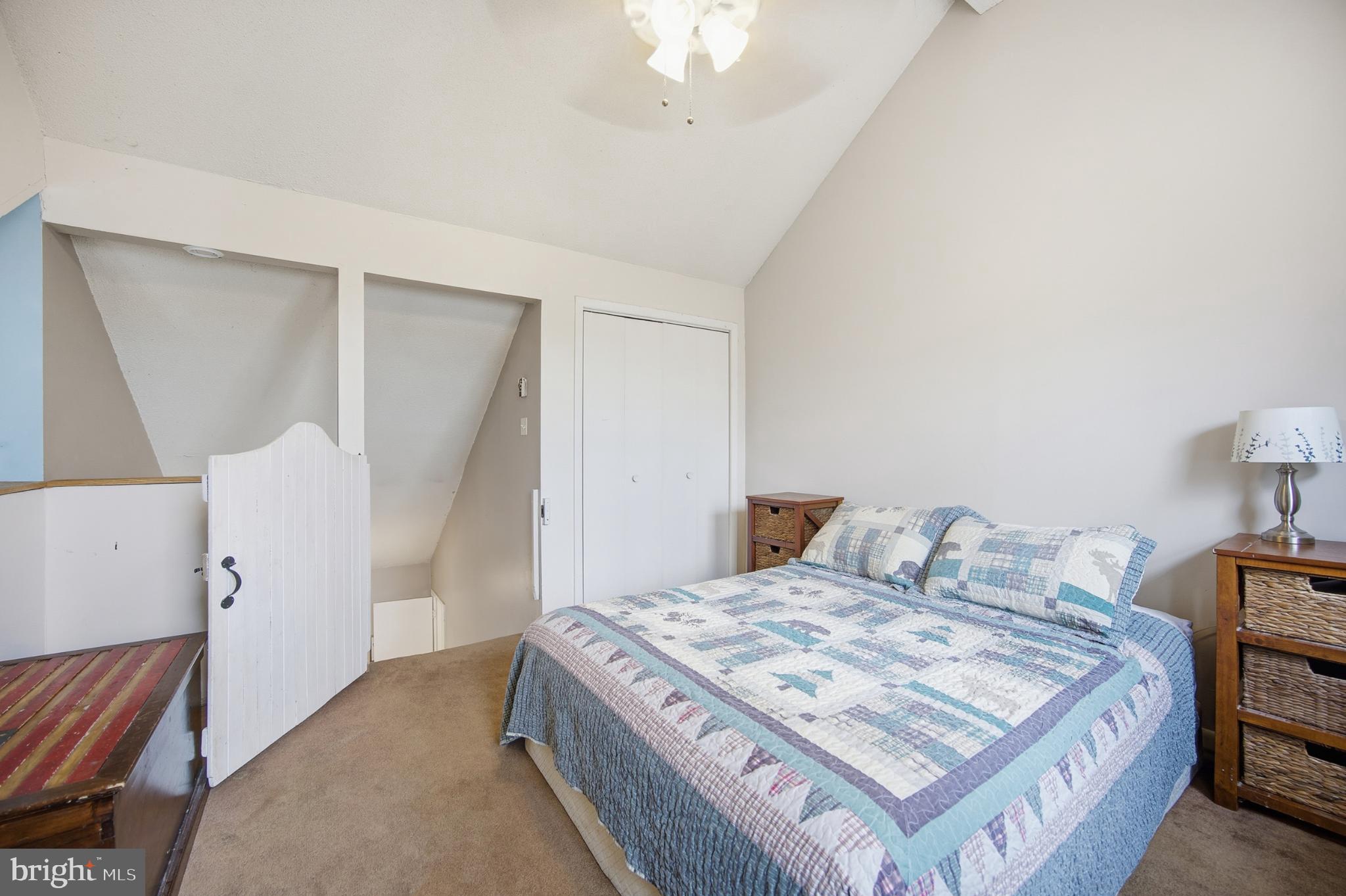 128 Hemlock Lane Gerrardstown, WV 25420 - Photo 5 of 44 a bedroom with a bed and a potted plant on the dresser