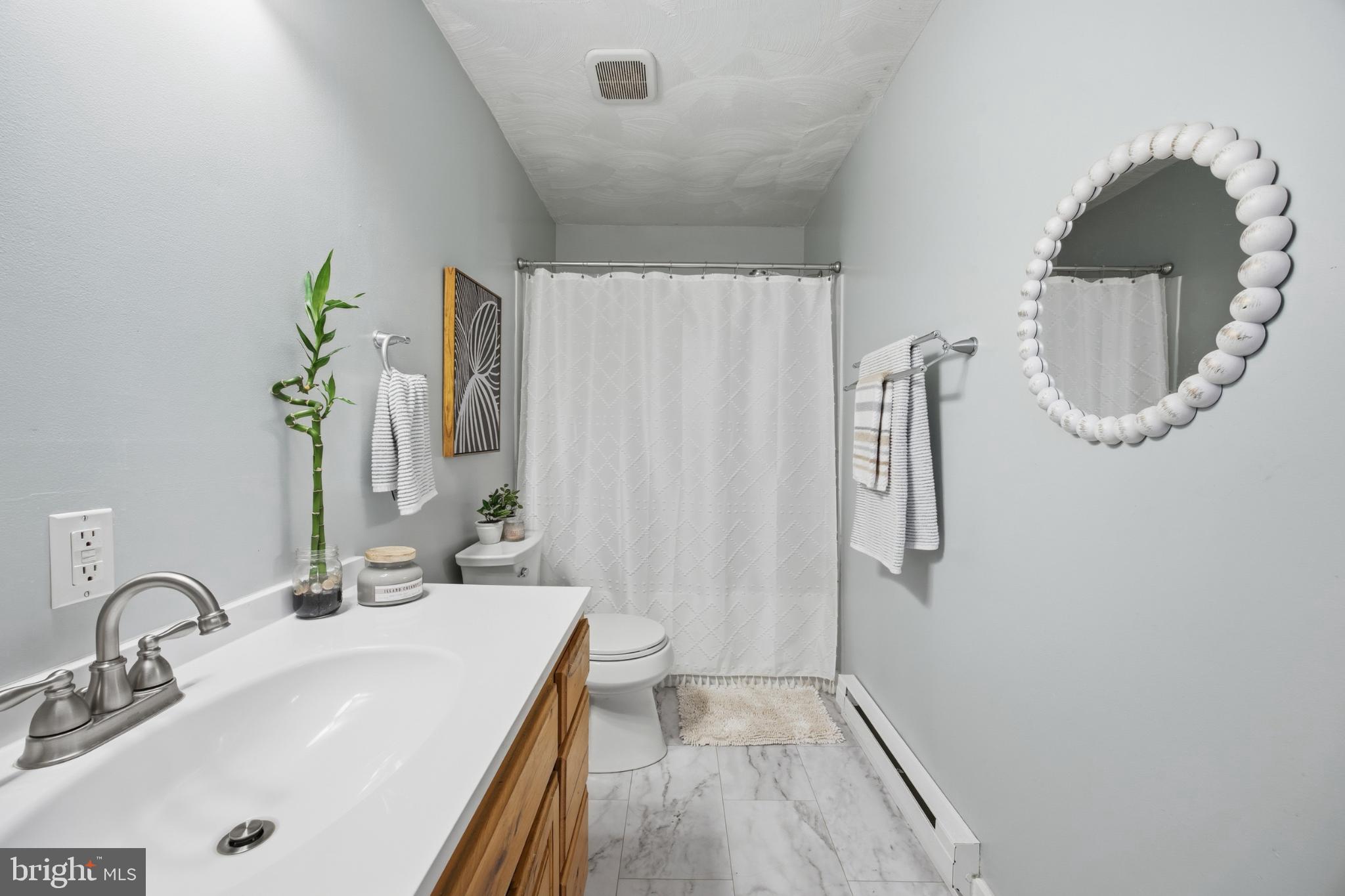 128 Hemlock Lane Gerrardstown, WV 25420 - Photo 9 of 44 a bathroom with a sink and a mirror