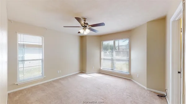 a view of an empty room with a window