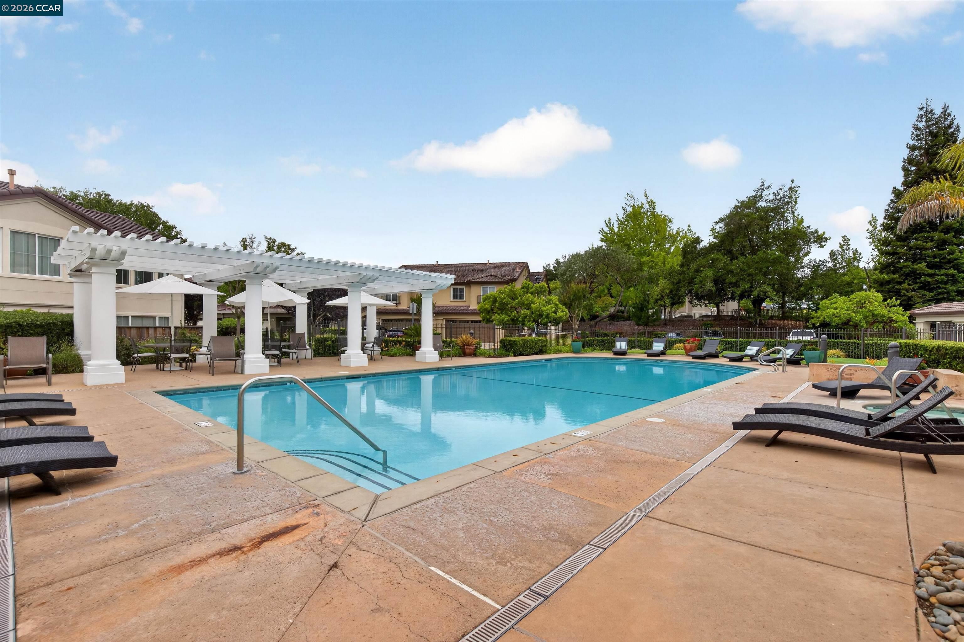124 Coralflower Lane San Ramon, CA 94582 - Photo 36 of 47 a view of a swimming pool with lounge chair