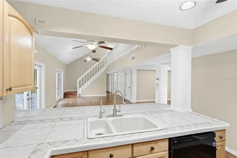 a kitchen with a sink and a refrigerator