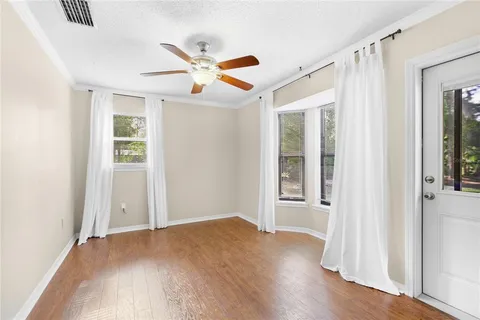 a bedroom with a bed and a potted plant
