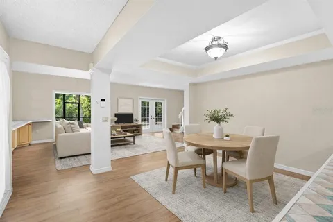 a view of a livingroom with furniture and a kitchen