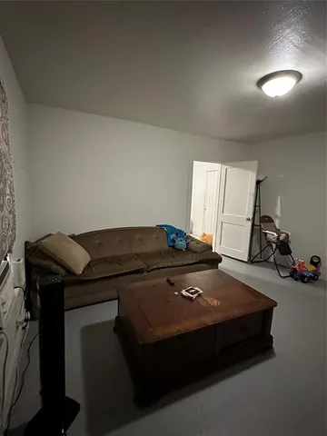 a bed sitting in a room next to a window