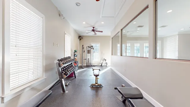 a room with gym equipment and a large window