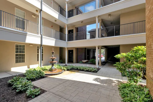 a view of a building with potted plants