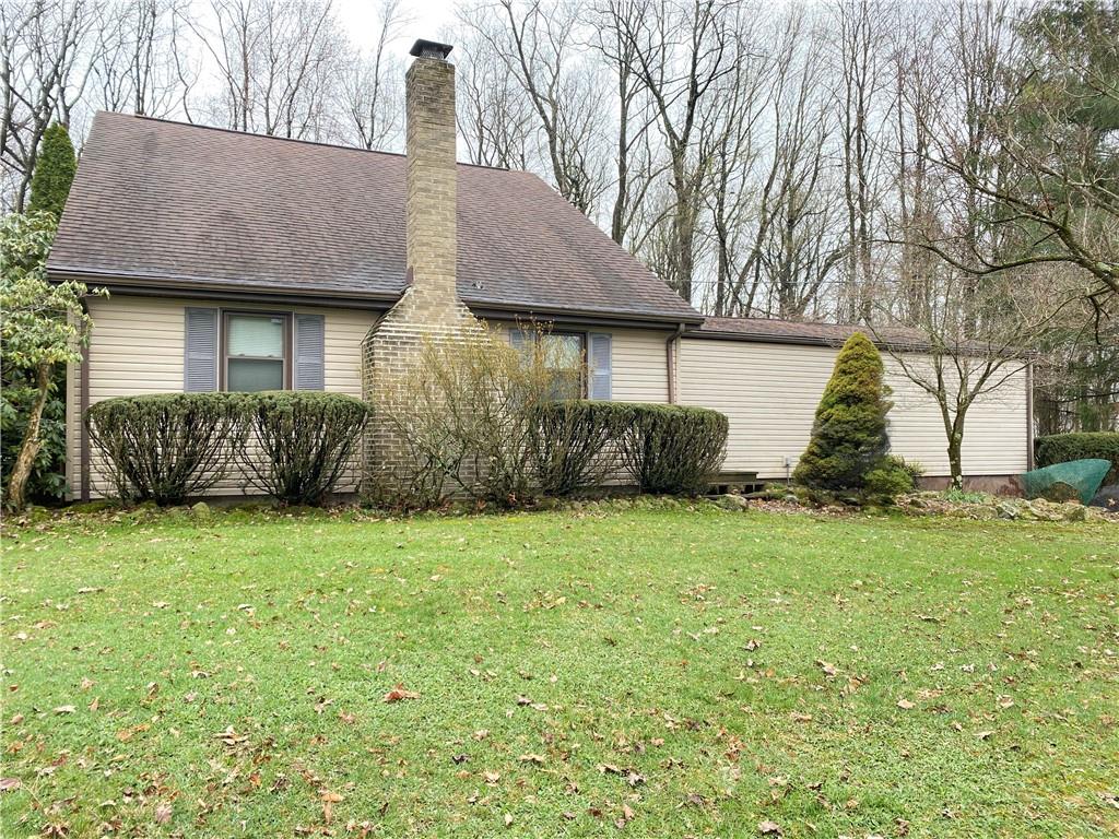 692 Mitchell Hill Road Greenville, PA 16125 - Photo 1 of 49 a front view of a house with a garden