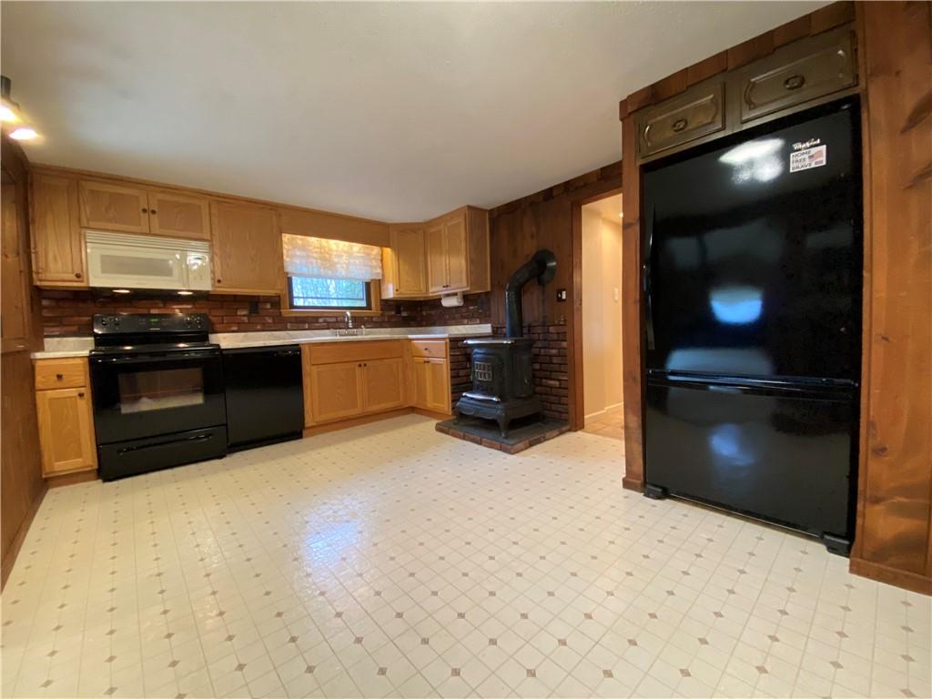 692 Mitchell Hill Road Greenville, PA 16125 - Photo 18 of 49 a kitchen with stainless steel appliances kitchen island granite countertop a refrigerator stove and sink