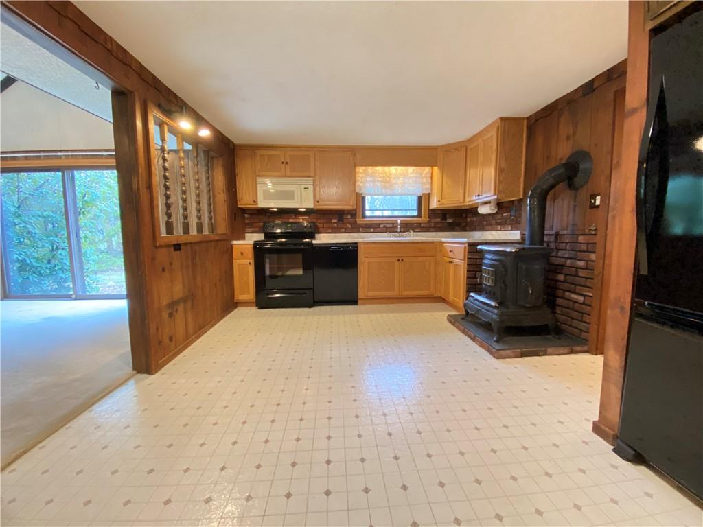 692 Mitchell Hill Road Greenville, PA 16125 - Photo 19 of 49 a kitchen with stainless steel appliances a refrigerator and a stove top oven