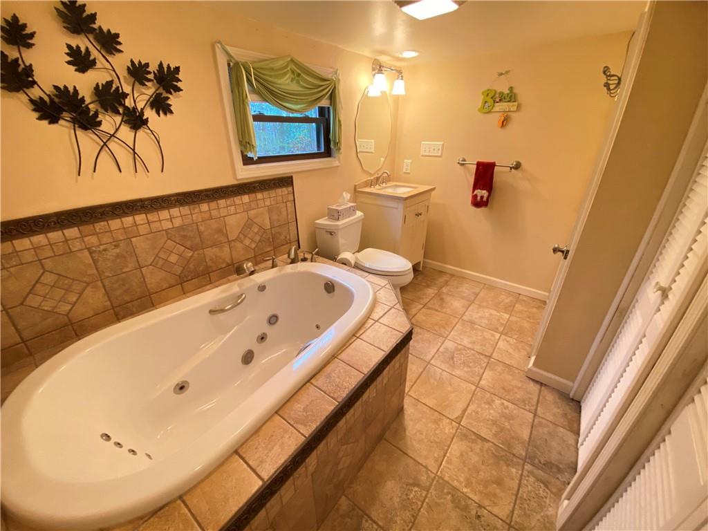 692 Mitchell Hill Road Greenville, PA 16125 - Photo 21 of 49 a bathroom with a tub and a shower
