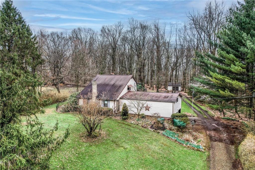 692 Mitchell Hill Road Greenville, PA 16125 - Photo 3 of 49 a view of a house with a yard and lake view