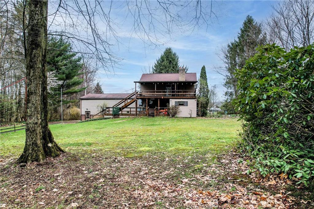 692 Mitchell Hill Road Greenville, PA 16125 - Photo 9 of 49 a view of a house with backyard and a tree
