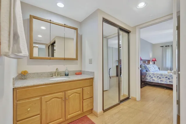 a en suite bathroom with double sink and a mirror