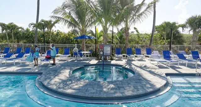 a view of a swimming pool with sitting area