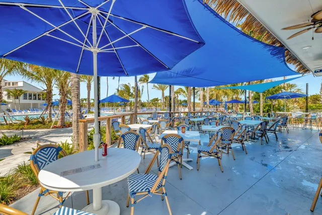 an outdoor space with furniture and umbrella