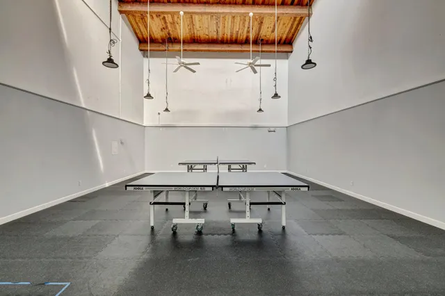 a view of table and chairs in the room