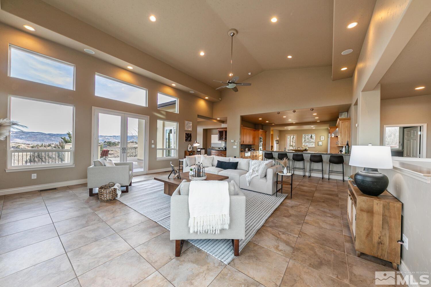 220 Brunswick Mill Road Reno, NV 89511 - Photo 12 of 39 a living room with furniture and a large window