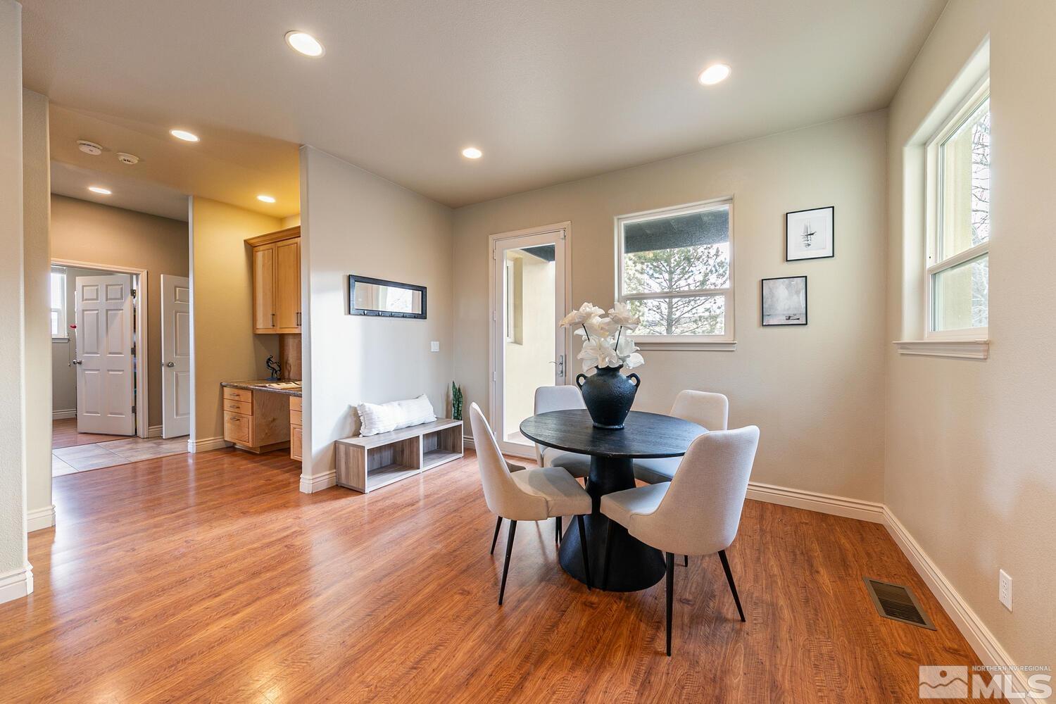 220 Brunswick Mill Road Reno, NV 89511 - Photo 18 of 39 a view of a dining room with furniture window and wooden floor