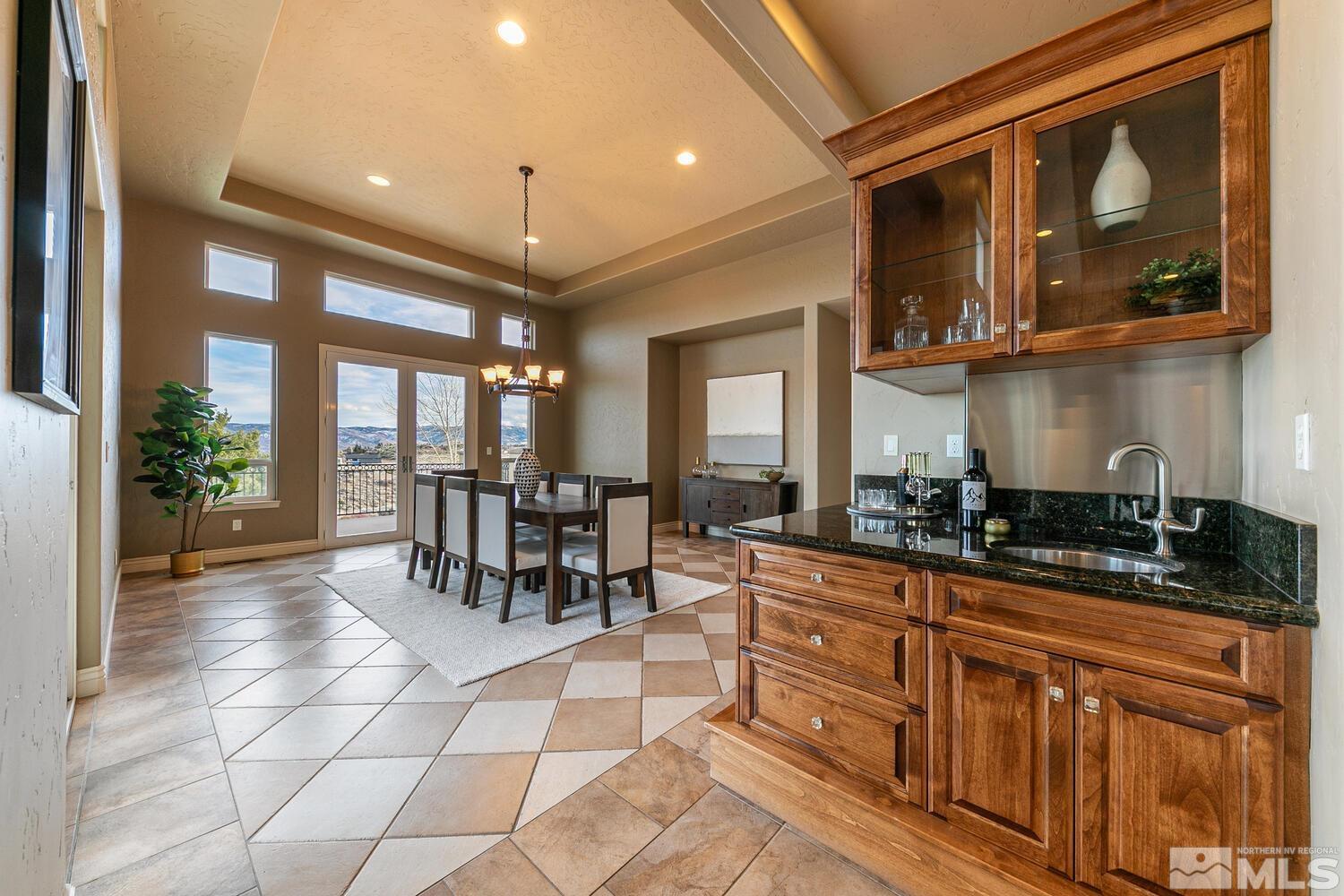 220 Brunswick Mill Road Reno, NV 89511 - Photo 20 of 39 a dining hall with stainless steel appliances granite countertop a stove and cabinets
