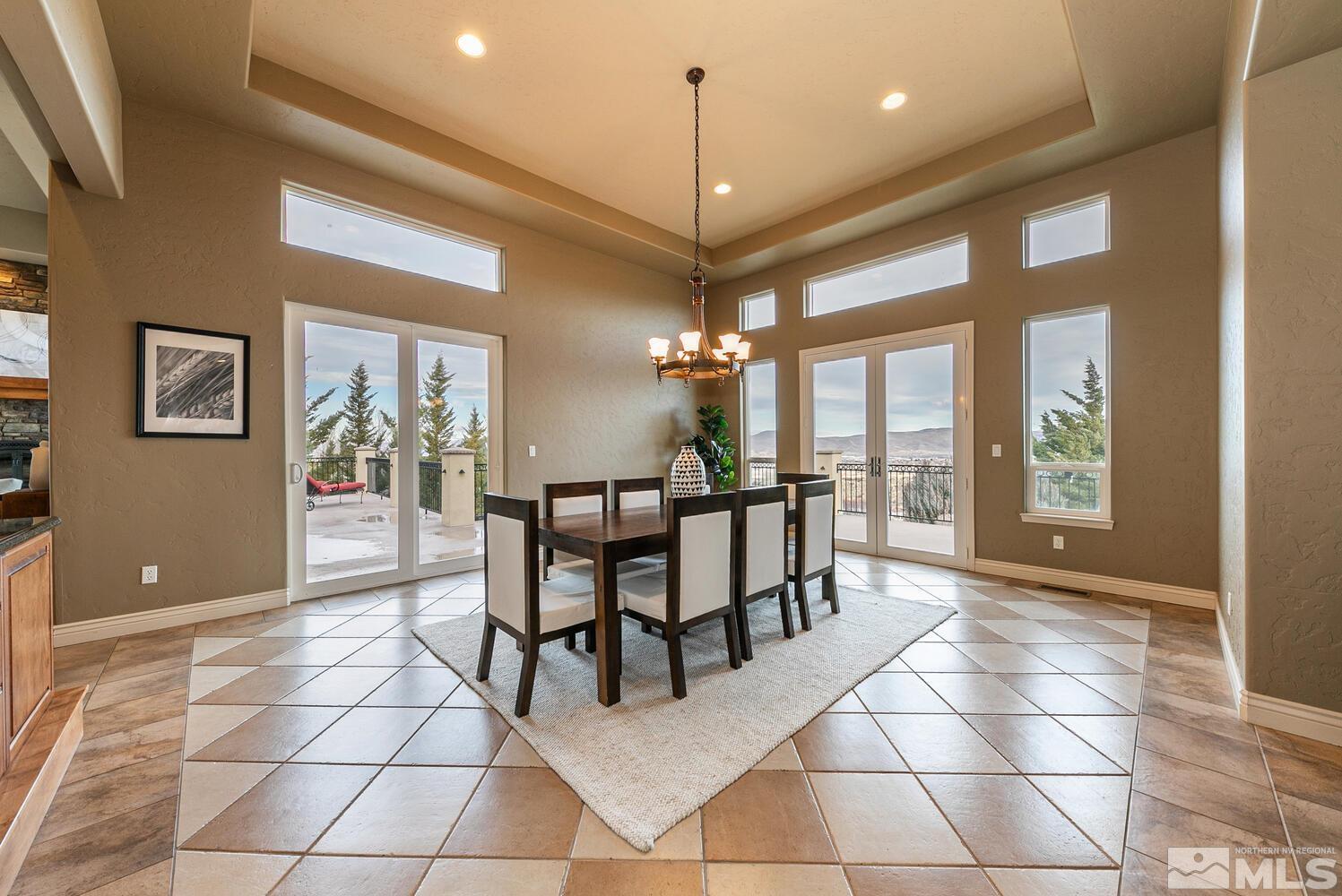 220 Brunswick Mill Road Reno, NV 89511 - Photo 21 of 39 a view of a dining room with furniture and chandelier