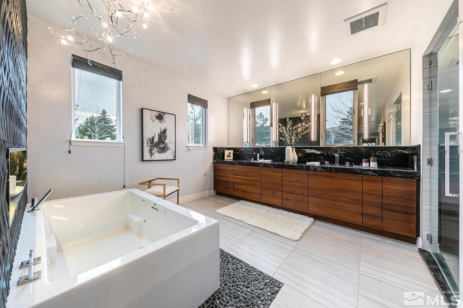 220 Brunswick Mill Road Reno, NV 89511 - Photo 25 of 39 a spacious bathroom with a large tub sink and mirror
