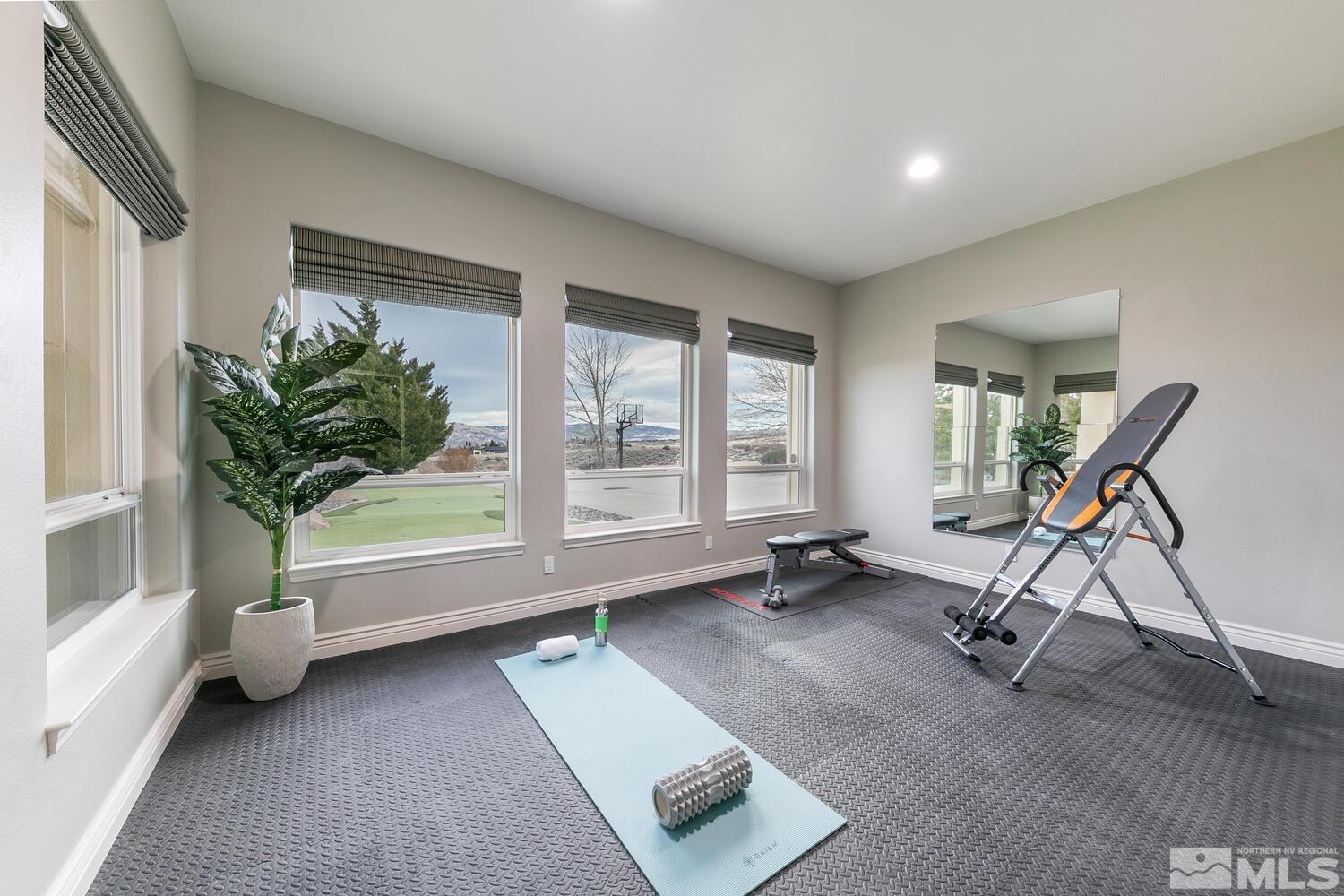220 Brunswick Mill Road Reno, NV 89511 - Photo 29 of 39 a view of a room with gym equipment and a large window