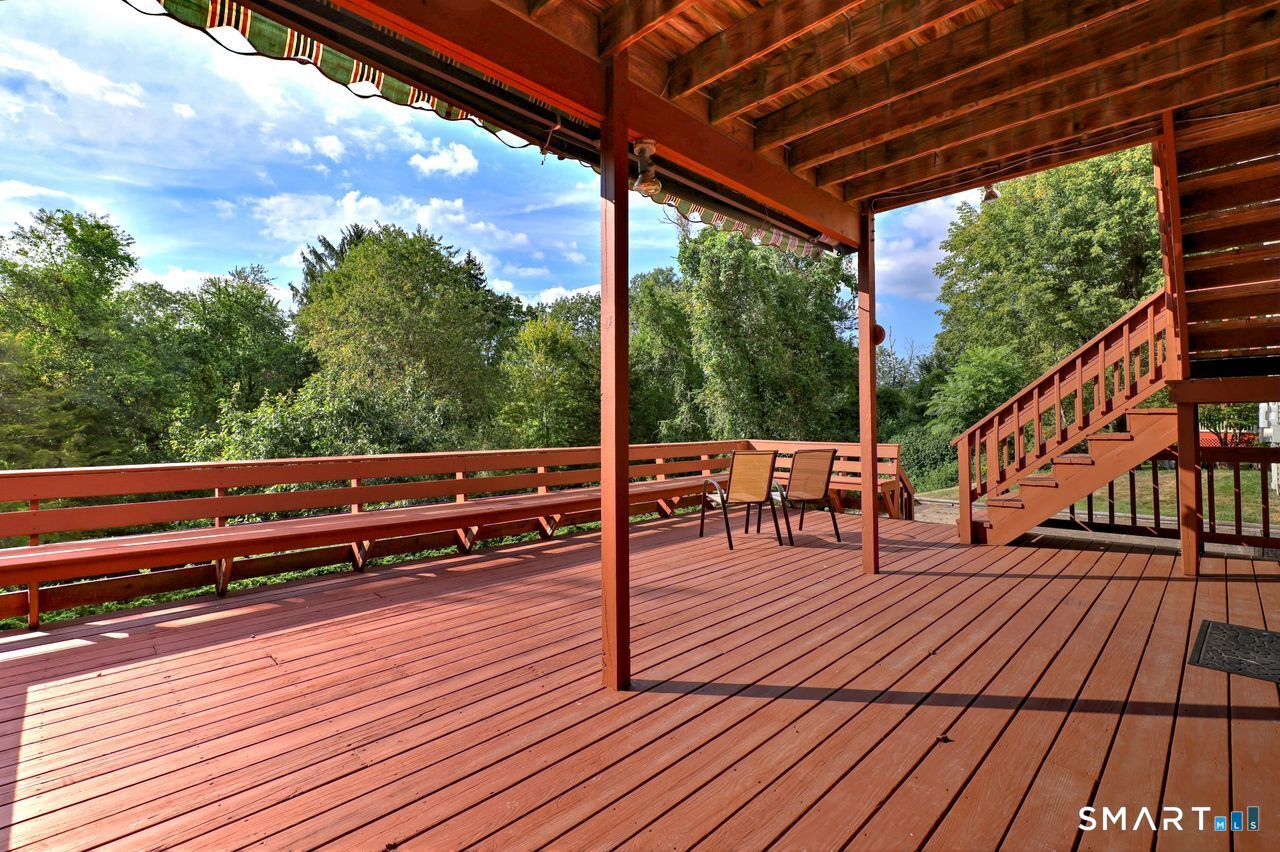 90 Brook Hill Road Hamden, CT 06514 - Photo 17 of 36 a view of a chairs on wooden deck
