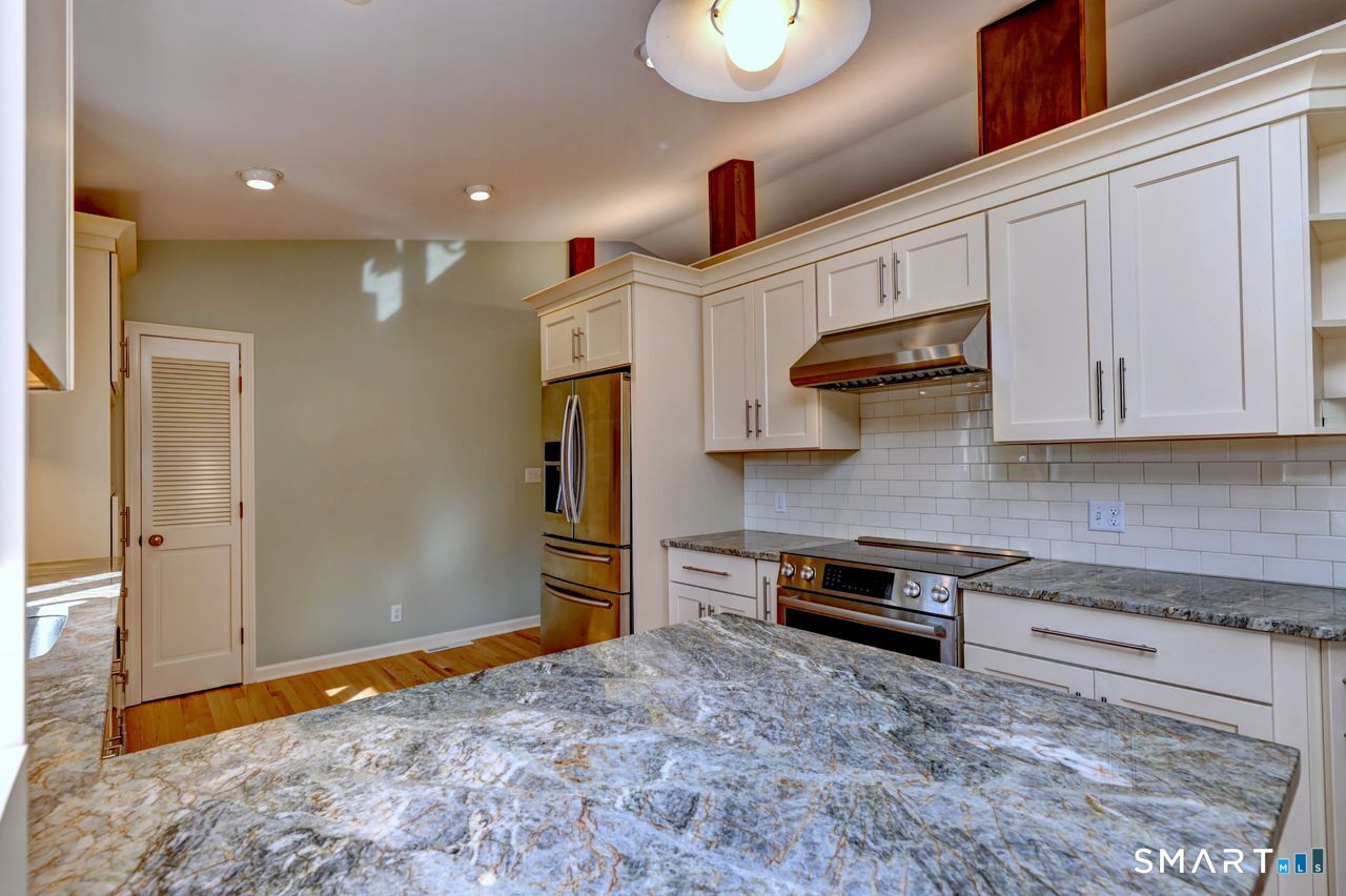 90 Brook Hill Road Hamden, CT 06514 - Photo 17 of 36 Kitchen remolded with new cabinets, stainless steel appliances, granite counters, hardwood floor