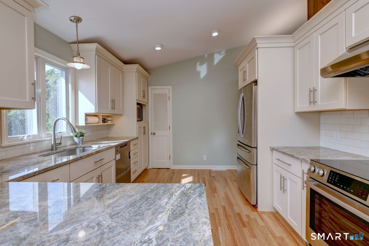 90 Brook Hill Road Hamden, CT 06514 - Photo 18 of 36 Kitchen remolded with new cabinets, stainless steel appliances, granite counters, hardwood floor