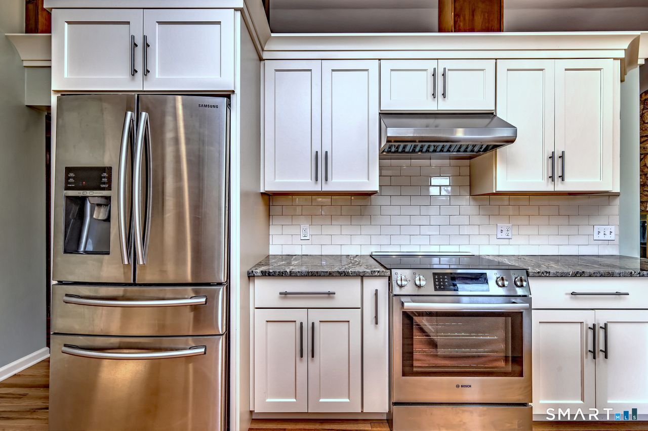 90 Brook Hill Road Hamden, CT 06514 - Photo 20 of 36 a kitchen with appliances and cabinets