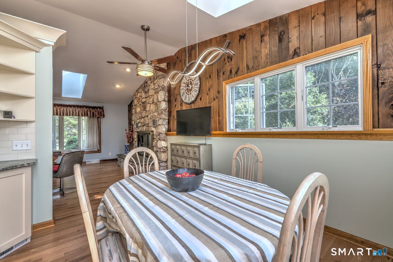 90 Brook Hill Road Hamden, CT 06514 - Photo 2 of 36 a view of a dining room with furniture and chandelier