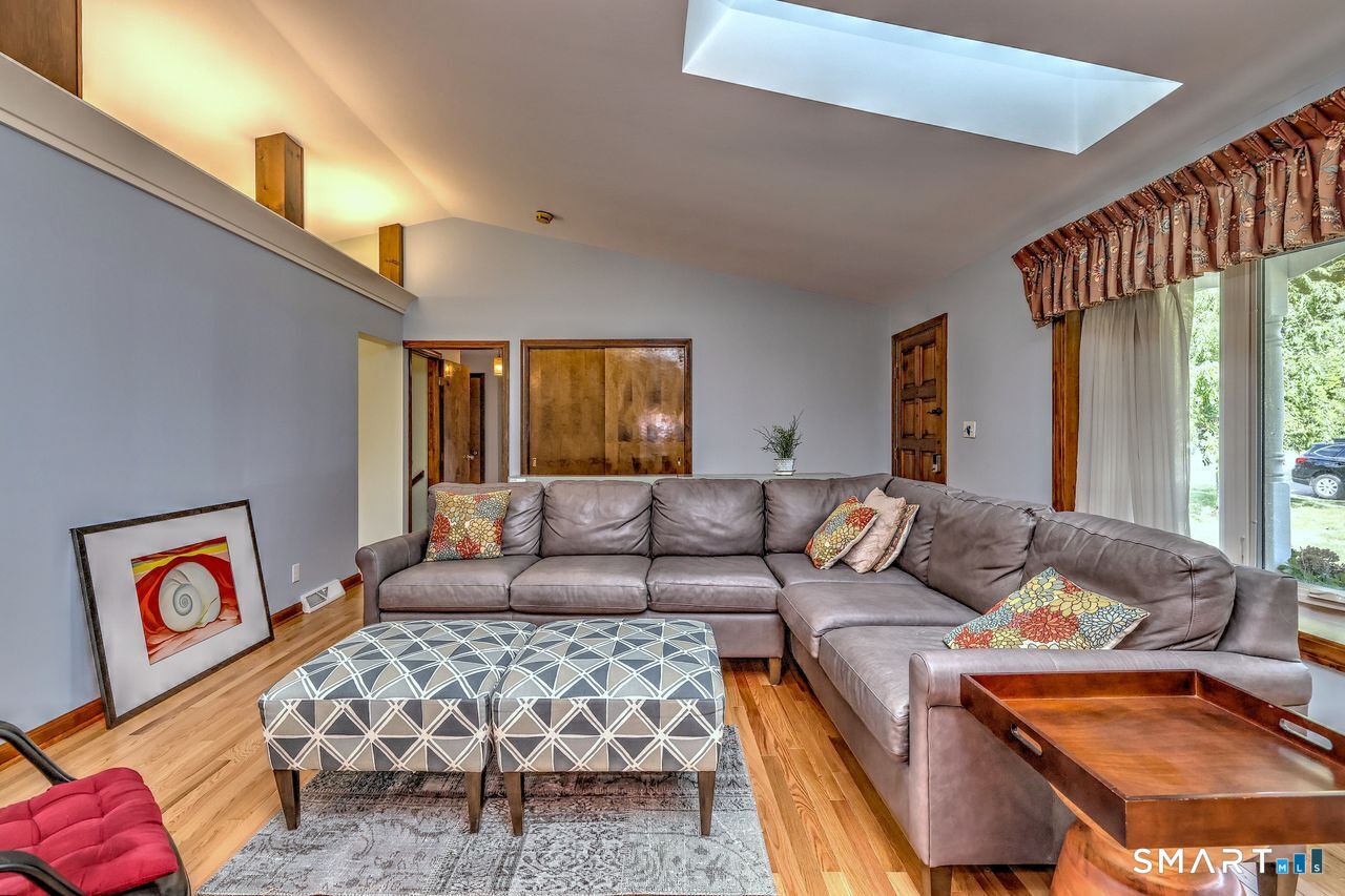 90 Brook Hill Road Hamden, CT 06514 - Photo 32 of 36 a living room with furniture and a couch